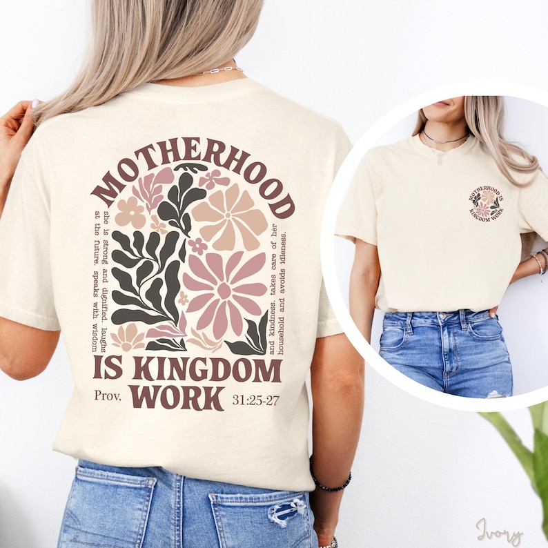 a woman wearing a white t-shirt with a floral design and text printed on it.