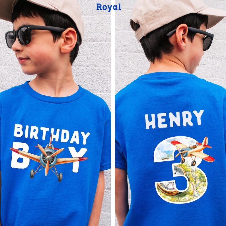 A boy wearing a blue t-shirt with a graphic of a propeller plane and the text "Birthday Boy" printed on it.