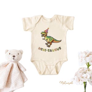 Dinosaur-themed family birthday shirts including a Three Rex or Four Rex kids tee with name and age on back, plus matching Mama Saurus, Dada Saurus, and sibling designs — ideal for dinosaur birthday parties.