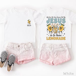 Personalized Jesus Lemonade Shirt with happy lemon graphics and the quote “Life Gave Me Some Lemons, But My Jesus He Be Makin’ Lemonade” — cute faith based kids sweatshirt and Christian shirt.