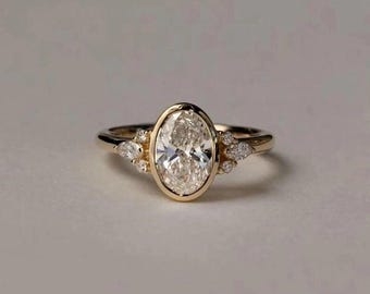 3 Ct Oval Moissanite Bezel Engagement Ring • 14K Gold Three Stone Ring • Pear Side Stone Unique Oval Cut Ring • Dainty Gold Bridal Jewelry