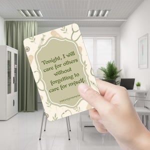 May include: A rectangular card with a sage green center panel featuring the text: Tonight, I will care for others without forgetting to care for myself. The border has a cream background with illustrations of medical items like syringes and bandages.