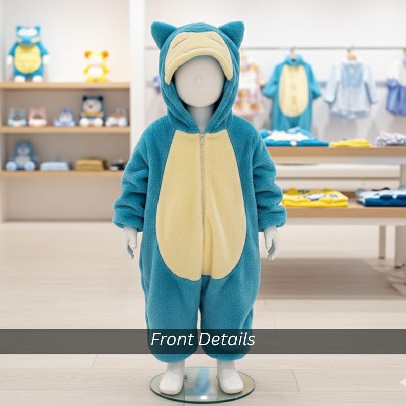 May include: A blue and cream-colored fleece jumpsuit with a hood, zipper, and character design. The costume is displayed on a mannequin. The text "Front Details" is at the bottom of the image.