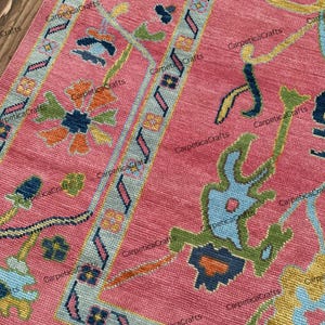 Hand-Knotted Wool Oushak Rug: Pink Turkish Floral Area Carpet