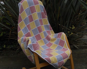 Blanket/afghan/throw, hand knitted checkered squares harlequin style.  Pretty pastel colours,  generous size 55 in x 38 in.