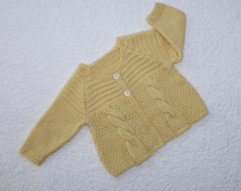 Cardigan/jacket/sweater for a baby girl. Hand knitted in pale yellow soft acrylic yarn, to fit chest 16-18 in chest,  approx 3-9 months.