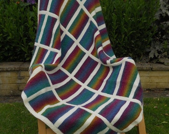 Throw/blanket/afghan, hand knitted in rainbow colours,  Window pane / stained glass effect using wool mix yarn.  Approx 43 in x 44 in