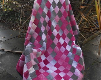 Throw/blanket/afghan, hand crocheted Tunisian stitch using wool mix yarn.  Pink/grey/white checkered/harlequin design, approx 56 in x 46 in