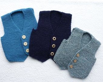 Baby boys vest/waistcoat/tank top/slip over hand knitted in three shades of blue yarn. Approx ages 3- 6months, 12-18 months and 2-3 yrs