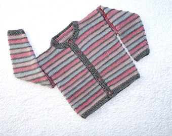 Baby girl striped cardigan/sweater, hand knitted in pinks and greys. Age approx 18m -2 yrs, chest 20-22 in. Vogue pattern.