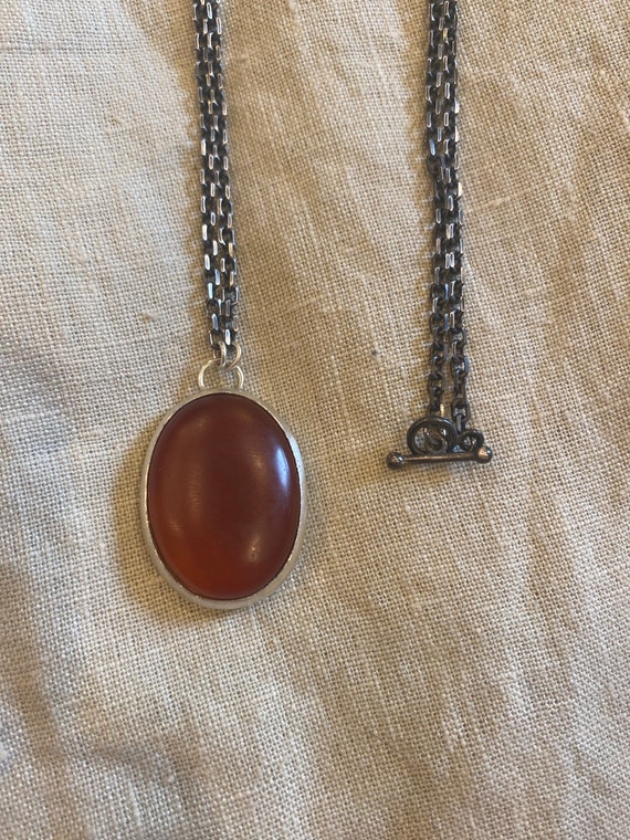 Deep matte carnelian stone pendant