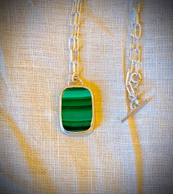 Classic Malachite Pendant with 24” sterling silver chain and setting.