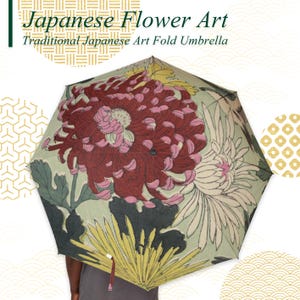 May include: A Japanese Flower Art fold umbrella with a floral design. The umbrella features a large, detailed illustration of a red and pink chrysanthemum flower, with yellow and white accents. The text "Japanese Flower Art" is at the top.