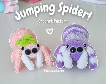 May include: Two crocheted jumping spiders, one pink with green accents and one purple with white accents. The spiders have large black eyes and are posed with their legs outstretched. The text "Jumping Spider! Crochet Pattern" is above the spiders.