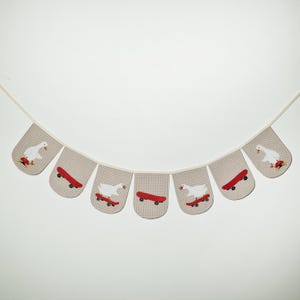 Fun goose nursery decor with white goose skateboard appliques on beige mini-check, handmade garland and kids room bunting