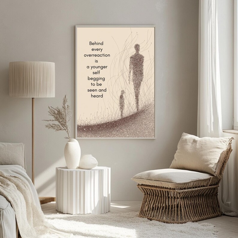 May include: Framed art print with a beige background featuring two stylized figures and the text: "Behind every overreaction is a younger self begging to be seen and heard." The artwork is in shades of brown and beige.