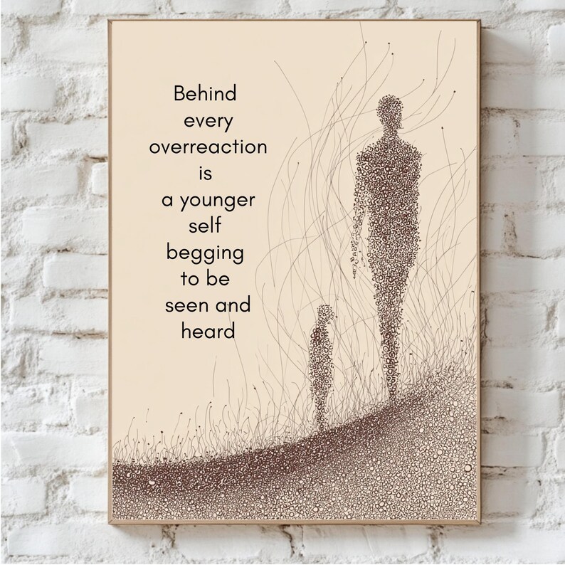 May include: A framed art print with a beige background and the text "Behind every overreaction is a younger self begging to be seen and heard." The artwork features two figures and abstract lines.