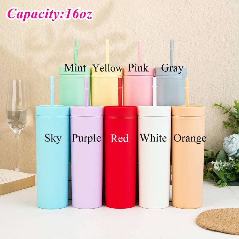 May include: A selection of 16 oz tumblers with straws in a range of colours. The tumblers are in shades such as sky blue, purple, red, white, and orange. The lids and straws match the tumbler colours. The text "Capacity: 16oz" is at the top.