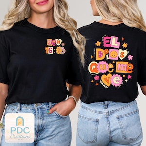 May include: Black t-shirts with colorful text and floral designs. One shirt features "gen 16:13" and the other says "EL Dios Que me Ve" with "GEN.16:13" below. The shirts have a retro, groovy aesthetic.