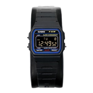 May include: Black Casio F-91W digital watch with a rectangular face and a black resin band. The watch face has a blue border and displays the time, day, and date. The watch is water-resistant and features an alarm and chronograph functions.