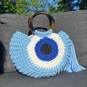 Bolso de mano de ganchillo con diseño de ojo malvado hecho a mano para vacaciones de verano en Grecia, envío gratuito, azul bebé o caqui.
