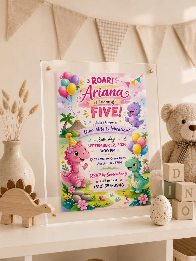 May include: A rectangular acrylic sign displaying a birthday invitation for Ariana turning five. The design features colorful cartoon dinosaurs, balloons, and tropical foliage. Text includes ROAR! Ariana is Turning FIVE! Join Us for a Dino-Mite Celebration! Saturday, September 12, 2026, 3:00 PM, 742 Willow Creek Drive, Austin, TX 78704, and RSVP by September 5, Call or Text (512) 555-3948.