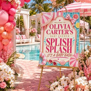 May include: A decorative sign on a gold easel welcomes guests to Olivia Carter's baby shower. The sign features pink and white stripes, a bow, and the words "Splish Splash, It's a Baby Bash." The scene is decorated with pink balloons and flowers.
