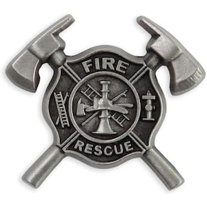 May include: A silver-toned metal pin featuring a central circular emblem with the text FIRE and RESCUE. The emblem displays a nozzle, ladder, and hydrant, framed by two crossed axes. The design has a matte, weathered finish with raised details.