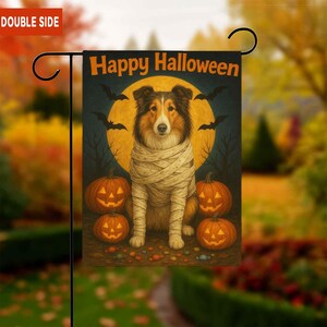 May include: A double-sided Halloween garden flag featuring a dog wrapped in bandages, with a full moon and bats in the background. The flag reads "Happy Halloween" in orange text, with jack-o'-lanterns at the bottom.