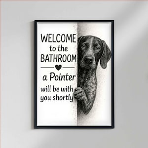May include: Framed wall art featuring the text "WELCOME to the BATHROOM" and "a Pointer will be with you shortly". A black and white illustration of a Pointer dog peeks from behind a wall. The artwork is in a black frame.