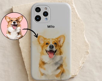 May include: A light grey smartphone case featuring a watercolour-style illustration of a brown and white Corgi dog with its tongue out. The name Milo is printed in black above the dog. A circular inset shows the original photo of the same dog.