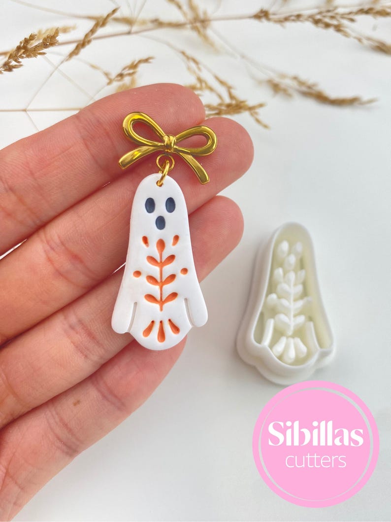 Folk art clay cutter set for polymer clay earrings, Nordic fall designs, handmade charms, and seasonal jewelry making.