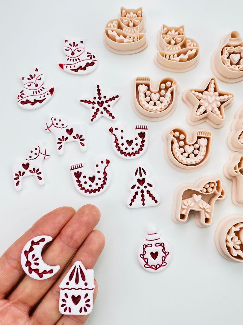 Scandinavian folk art Christmas clay cutters with dala horse, fox, and dove.