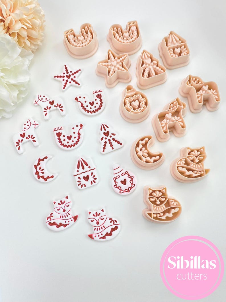 Polymer clay earring cutters with Nordic Christmas motifs and folk designs.