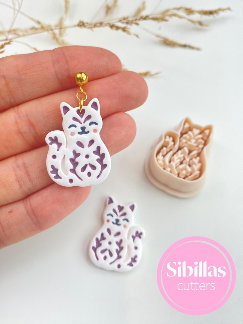 Polymer clay cutters for earrings with Nordic fall designs, folk art details, Halloween shapes, and handmade jewelry tools.