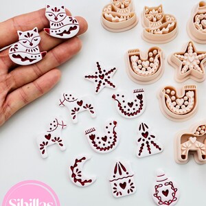 Nordic Christmas polymer clay cutter set with traditional folk symbols.