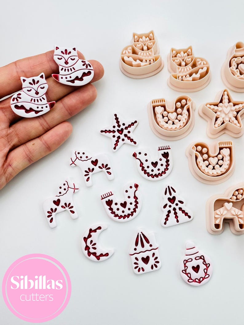 Nordic Christmas polymer clay cutter set with traditional folk symbols.