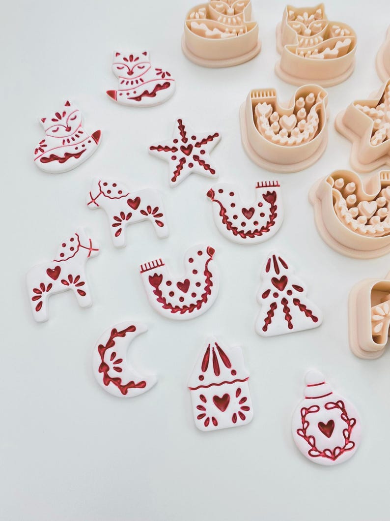Scandinavian Christmas polymer clay cutter set with festive folk designs.