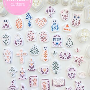 Polymer clay jewelry tools with folk art fall cutters, Scandinavian designs, ghost charms, pumpkins, and autumn earrings.