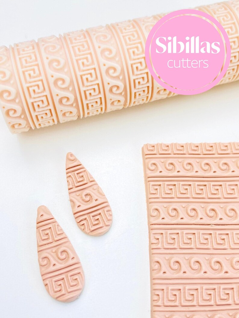 Ancient Greek pattern roller for polymer clay, ceramics, and pottery crafts. The roller creates finely detailed classical motifs reminiscent of traditional Greek art and architecture. Ideal for earrings, pendants, pottery surfaces, and home décor projects, this embossing tool is reusable and made for precision. It allows makers to add a timeless, ornamental look to their clay creations, perfect for DIY crafters, jewelry makers, and ceramic artists seeking elegant, historical designs.