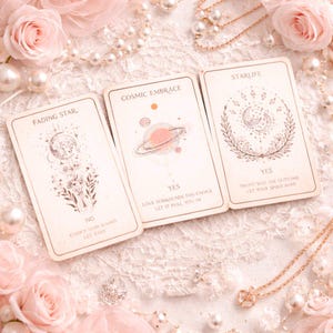 May include: Three tarot cards with celestial illustrations and text. The cards are titled "Fading Star," "Cosmic Embrace," and "Starlife." The "Cosmic Embrace" card features a planet with rings. The "Starlife" card has a crescent moon and floral design.