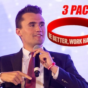 May include: A red silicone wristband with the text "BE BETTER, WORK HARDER" in white. The image also shows a person wearing a similar wristband. The words "3 PACK" are in red above the wristband.