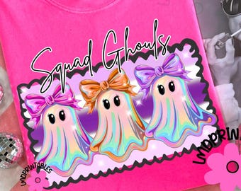 May include: A bright pink sweatshirt with the words "Squad Ghouls" in a script font. The graphic features three cartoon ghosts with colorful, iridescent bodies and bows. The sweatshirt has a crew neck and long sleeves.