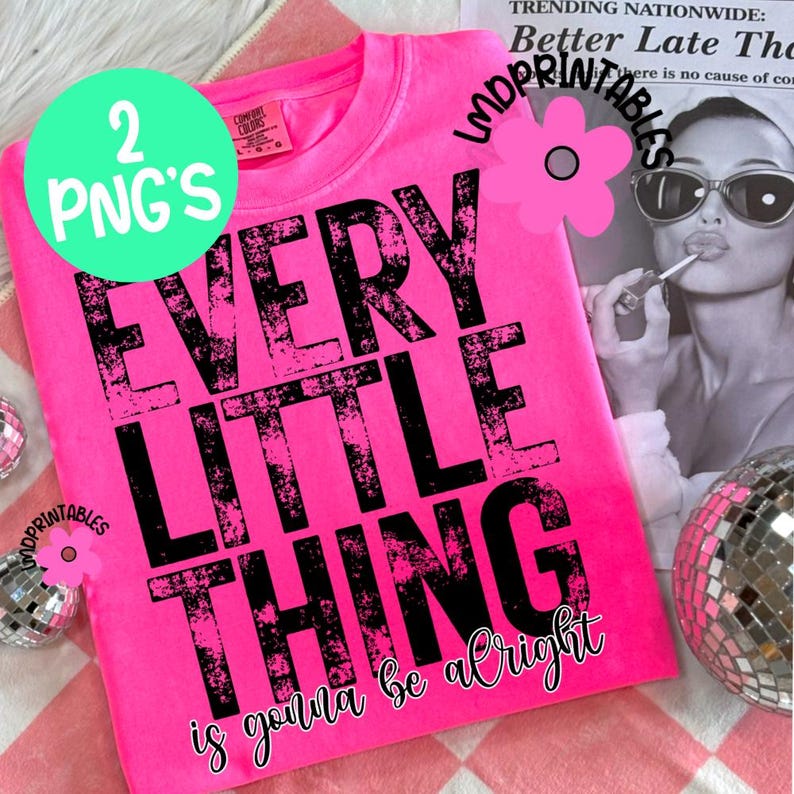 May include: A bright pink t-shirt with the phrase "EVERY LITTLE THING is gonna be alright" in distressed black lettering. The shirt also has a green circle with the text "2 PNG'S". The background includes a newspaper and a disco ball.