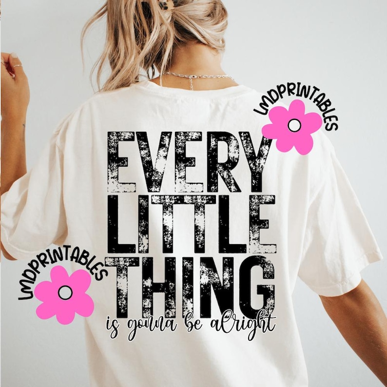 May include: Cream-colored t-shirt with the text "EVERY LITTLE THING is gonna be alright" in distressed black lettering. Pink flower graphics with the text "LMDPRINTABLES" are on the shirt.