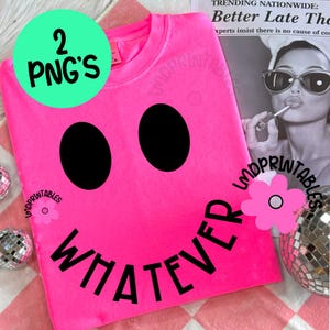 May include: A bright pink t-shirt with a large black smiley face design. The word "WHATEVER" is printed in black below the smiley face. A green circle with the text "2 PNG'S" is in the upper left corner.