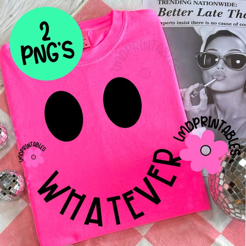 May include: A bright pink t-shirt with a large black smiley face design. The word "WHATEVER" is printed in black below the smiley face. A green circle with the text "2 PNG'S" is in the upper left corner.
