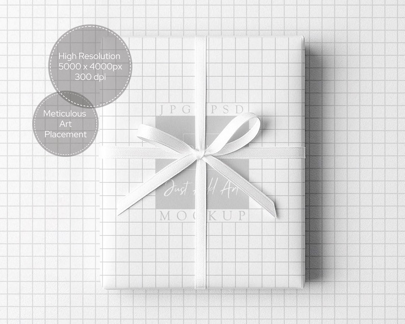 May include: A wrapped gift box with white grid paper and a white ribbon tied in a bow. The gift box is centered on a white grid background. Text on the image includes "High Resolution 5000 x 4000px 300 dpi" and "Meticulous Art Placement."