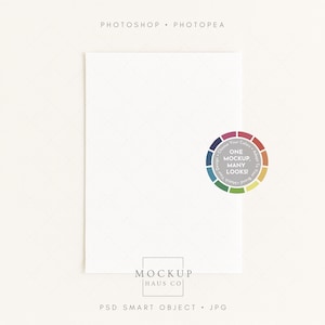 May include: A white rectangular mockup on a light background with the text "PHOTOSHOP • PHOTOPEA" at the top. A colorful wheel graphic with the text "ONE MOCKUP, MANY LOOKS!" is on the right. The bottom has the text "MOCKUP HAUS CO" and "PSD SMART OBJECT • JPG".