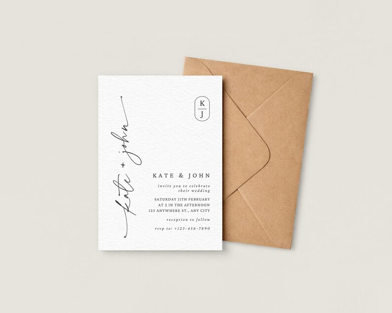 May include: A wedding invitation with the names "Kate + John" in elegant script. The invitation includes details about the wedding date, time, and location, along with a reception RSVP. A brown envelope is next to the invitation.
